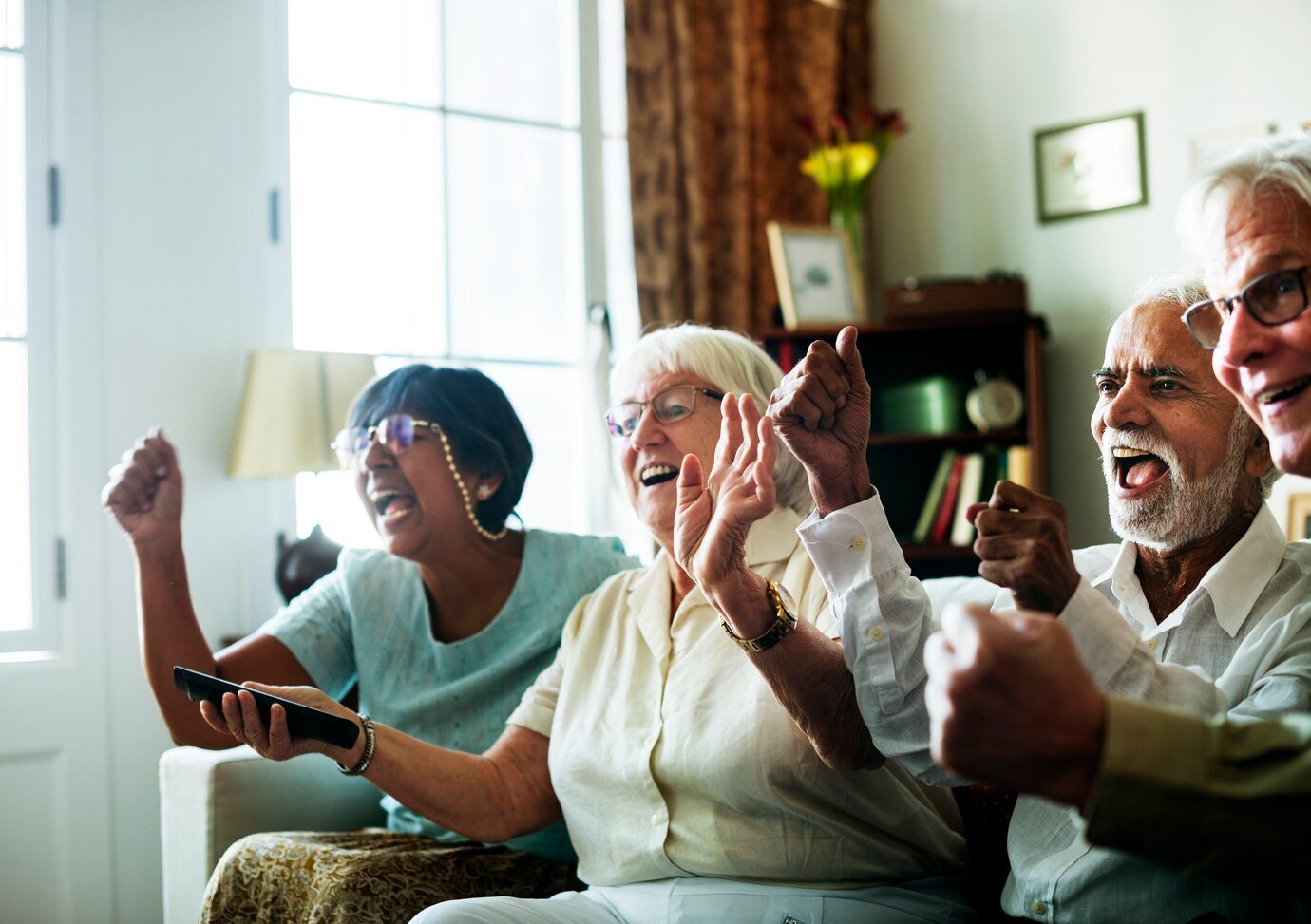 senior people watching televison together 53876 40956 Home